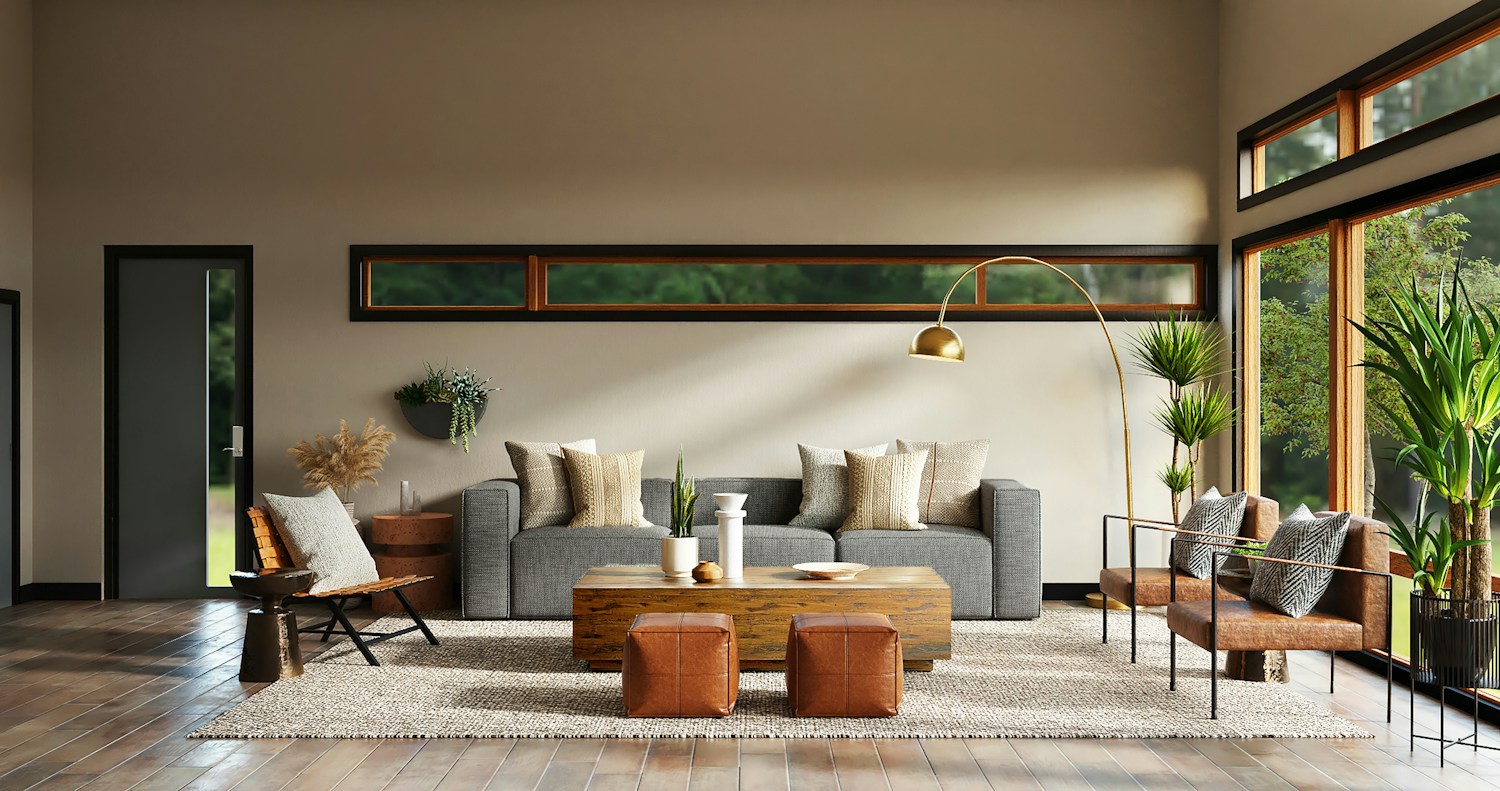 Warm neutral walls framing a grey sofa and timber furniture