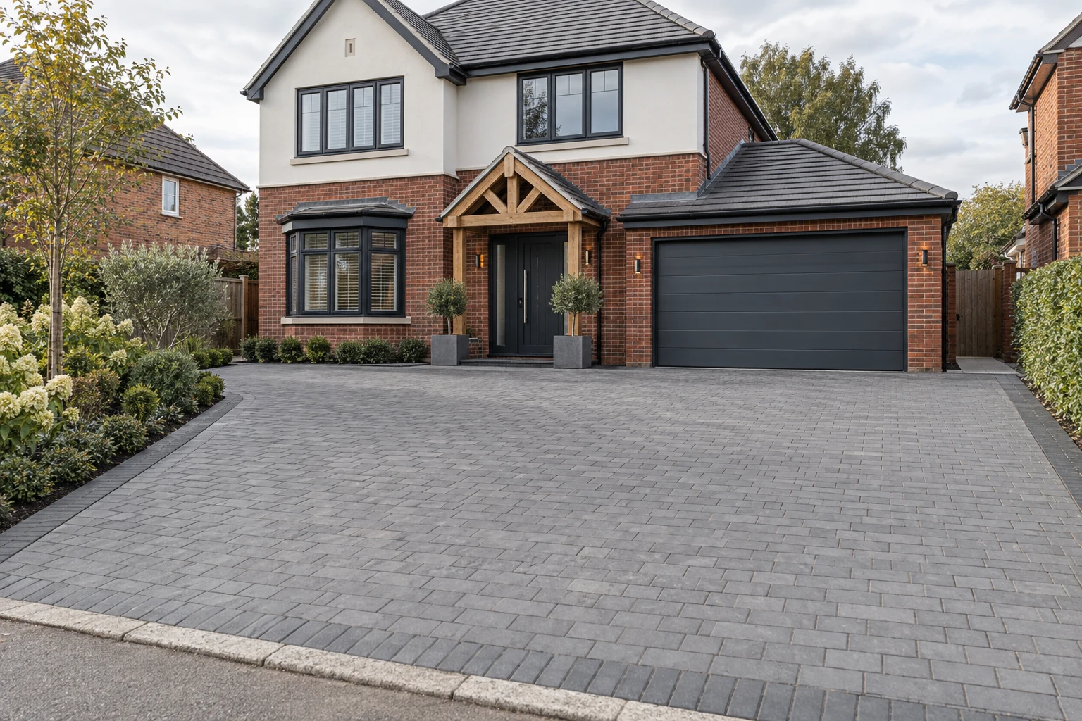 Architectural inspiration: grey block paving in front of a brick and render home