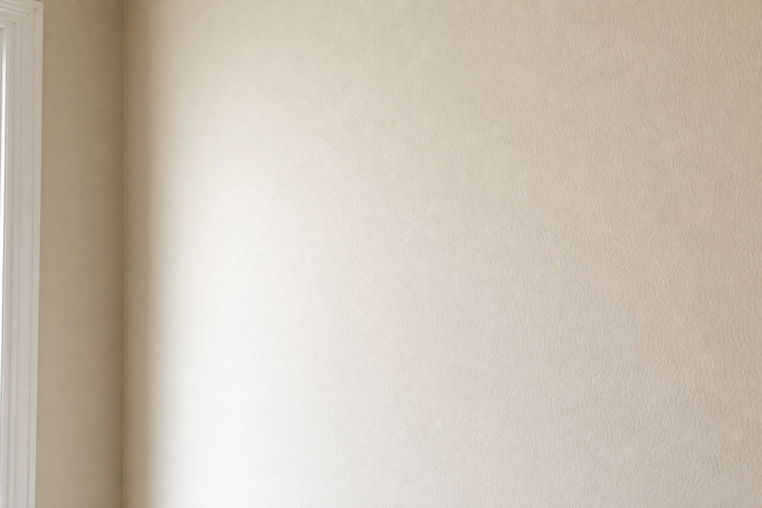 After repair: clean patched cream wall