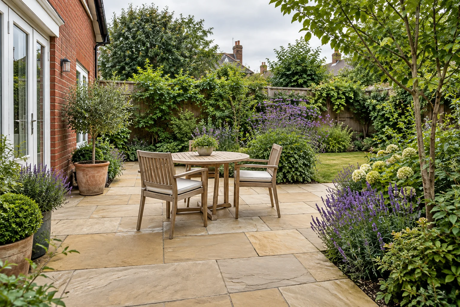 Generated inspiration: a sandstone terrace with a table and two chairs