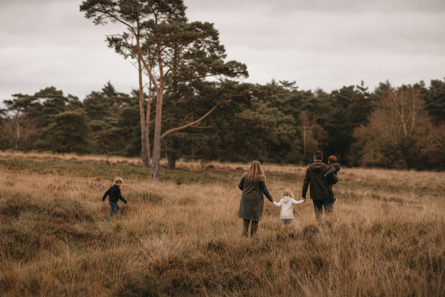 Family session from a distance near woodland and moorland