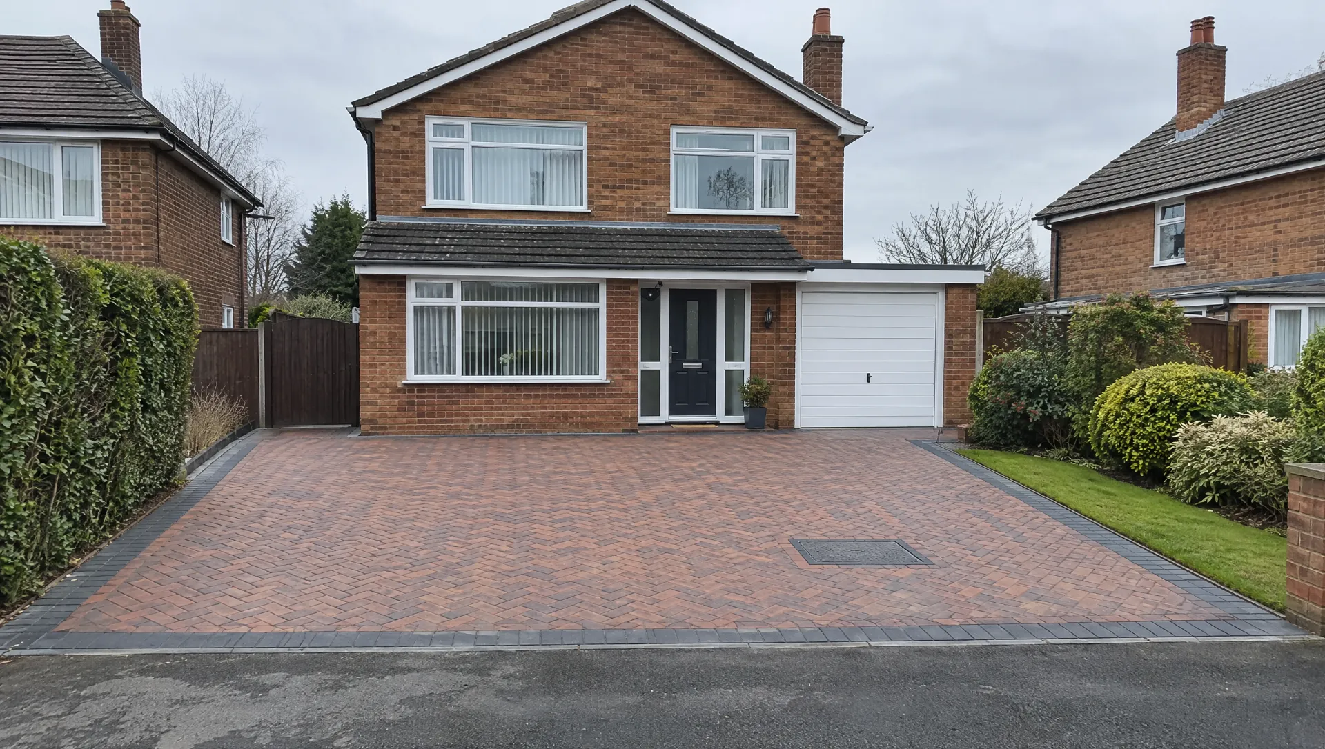 After: the same house with a new block paving driveway and charcoal border